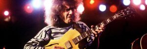 Colour portrait of guitarist Pete Metheny playing live